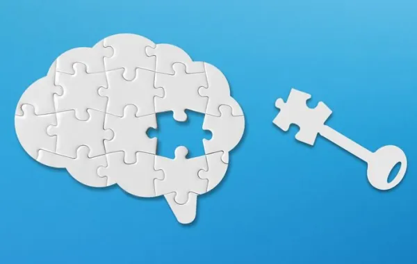 Un puzzle con forma de cerebro con una de las piezas separada simbolizando una llave