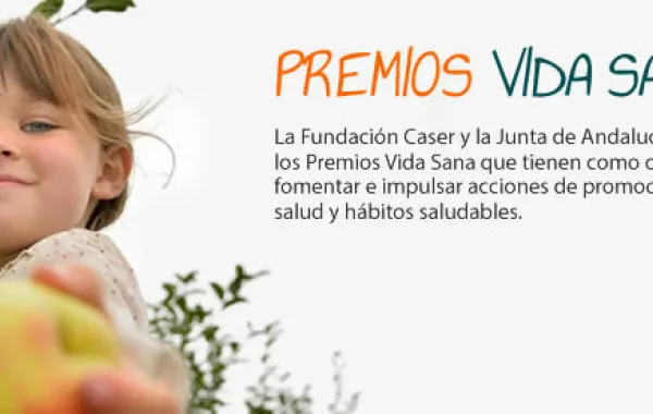 Foto del visual de los premios vida sana con una niña sosteniendo una manzana